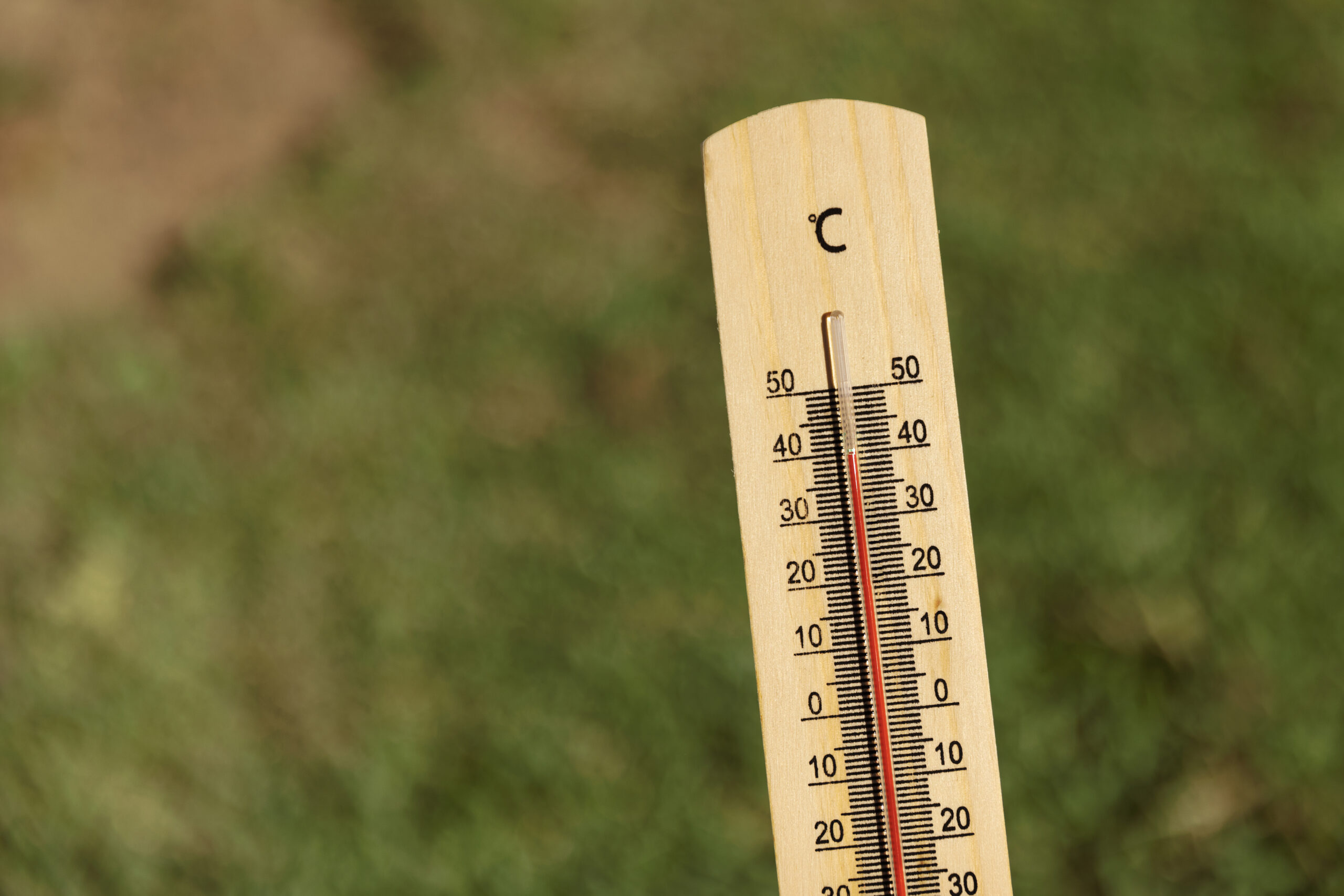 close up thermometer showing high temperature scaled